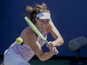 Vancouver's Rebecca Marino returns a shot to Zhang Shuai, of China, during the third round of the U.S. Open tennis championships, Friday, Sept. 2, 2022, in New York. Marino has been eliminated after a 6-2, 6-4 loss in the match.