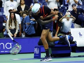 Tennis - U.S. Open - Flushing Meadows, New York, United States - September 7, 2022. Australia's Nick Kyrgios smashes his racket after his quarter final match against Russia's Karen Khachanov.