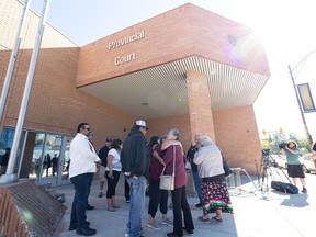 Family and supporters stand outside Saskatoon provincial court after the woman's first appearance. Photo taken in Saskatoon, Sask. on Monday, Aug 29, 2022.