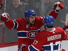 Canadiens' Sean Monahan (91) celebrates his goal with teammate Josh Anderson (17) during third period NHL action against the Toronto Maple Leafs in Montreal on Wednesday Oct. 12, 2022.