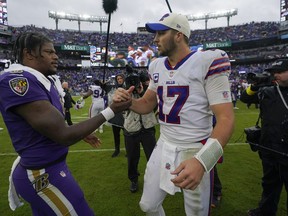 Baltimore Ravens quarterback Lamar Jackson (left) and Buffalo Bills quarterback Josh Allen shake hands after Sunday's game.