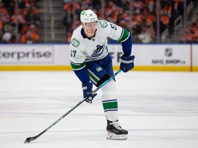 Tyler Myers #57 of the Vancouver Canucks skates against the Edmonton Oilers during the third period at Rogers Place on October 13, 2021 in Edmonton, Canada.