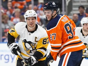 Connor McDavid of the Edmonton Oilers laughs with Sidney Crosby of the Pittsburgh Penguins at Rogers Place on Nov. 1, 2017.