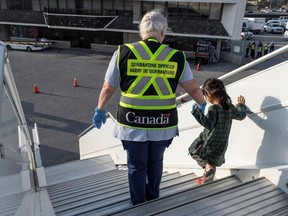 Afghan refugees who supported Canada's mission in Afghanistan arrive at Toronto Pearson International Airport on Aug. 24, 2021.
