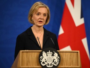 U.K. Prime Minister Liz Truss speaks at a press conference at 10 Downing Street in London after sacking her former Chancellor, Kwasi Kwarteng, Friday, Oct. 14, 2022.