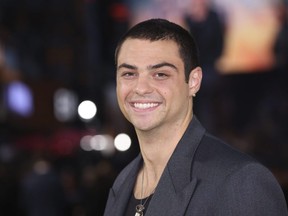 Noah Centineo poses for photographers upon arrival for the premiere of the film Black Adam on Oct. 18, 2022, in London.