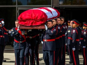 Pallbearers carry the casket of Const. Andrew Hong at the end of his funeral at the Toronto Congress Centre on Wednesday September 21, 2022. On September 12, 2022, 48-year-old Const. Andrew Hong died in the line of duty.
