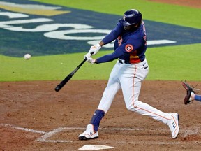 Astros left fielder Yordan Alvarez hits a two-run home run against the Mariners during the sixth inning of Game 2 of the ALDS at Minute Maid Park in Houston, Thursday, Oct. 13, 2022.
