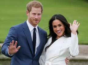 This file photo taken on Nov. 27, 2017 shows Prince Harry and his fiancee Meghan Markle posing for a photograph in the Sunken Garden at Kensington Palace in west London following the announcement of their engagement.