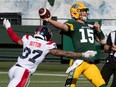 October 1, 2022 quarterback Taylor Cornelius (15) gets the ball away as he is hit by Wesley Sutton (37) as the Edmonton Elks and the Montreal Alouttes play at Commonwealth stadium in Edmonton. BRUCE EDWARDS/Edmonton Journal