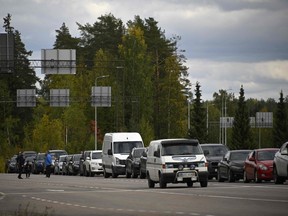 Cars coming from Russia wait in long lines at the border checkpoint between Russia and Finland near Vaalimaa, on Sept. 22, 2022.