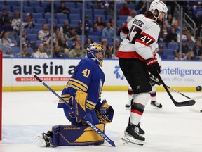 Ottawa Senators centre Mark Kastelic looks to deflect a shot on Buffalo Sabres goaltender Craig Anderson during the first period at the KeyBank Center on Thursday night.