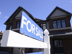 A new home is displayed for sale in a housing development in Ottawa on Tuesday, July 14, 2020.