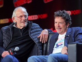Actors Christopher Lloyd and Michael J. Fox attend a "Back To The Future Reunion" at New York Comic Con on Oct. 8, 2022 in New York City.