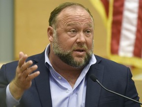 Conspiracy theorist Alex Jones takes the witness stand to testify at the Sandy Hook defamation damages trial at Connecticut Superior Court in Waterbury, Conn., Sept. 22, 2022.