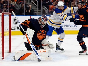 The Edmonton Oilers' goalie Stuart Skinner (74) makes a save against the Buffalo Sabres during second period NHL action at Rogers Place in Edmonton on Tuesday, Oct. 18, 2022.