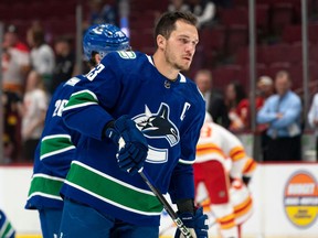 Canucks captain Bo Horvat, pictured during a pre-game warmup last week, is focusing on his on-ice play while contract extension talks continue as the final season kicks in on his US $5.5-million salary cap hit.