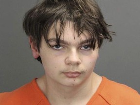 This booking photo released by the Oakland County, Mich., Sheriff's Office shows Ethan Crumbley, 15, who is charged as an adult with murder and terrorism for a shooting that killed four fellow students and injured more at Oxford High School in Oxford, Mich.