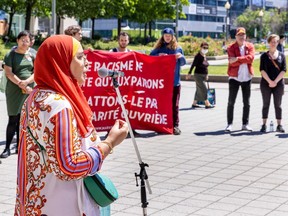 Samira Laouni, head of Muslim Awareness Week, speaks at a protest to mark the third anniversary of Bill 21 in June 2022.