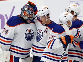 Teammates congratulate goaltender Stuart Skinner #74 of the Edmonton Oilers after the 4-2 win against the Florida Panthers at the FLA Live Arena on November 12, 2022 in Sunrise, Florida.