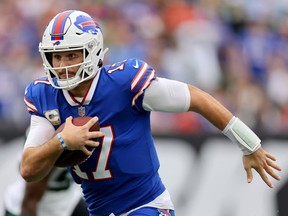 Josh Allen of the Buffalo Bills rushes against the New York Jets during the first half at MetLife Stadium on November 06, 2022 in East Rutherford, New Jersey.