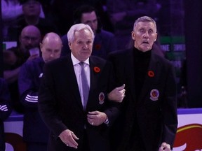 Darryl SIttler and Borje Salming walk out for ceremonies prior to the Toronto Maple Leafs against the Pittsburgh Penguins at the Scotiabank Arena on November 11, 2022 in Toronto, Ontario, Canada.