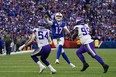 Buffalo Bills quarterback Josh Allen throws the ball against Minnesota Vikings linebacker Eric Kendricks (54) and defensive lineman Khyiris Tonga.