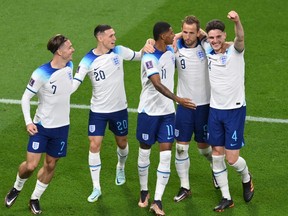Marcus Rashford of England celebrates with teammates after scoring their team's fifth goal during the FIFA World Cup Qatar 2022 Group B match between England and IR Iran at Khalifa International Stadium.