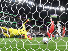 South Korea goalkeeper Kim Seung-gyu concedes a third goal against Ghana.