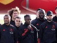 Members of Belgian's national football team (L-R) Kevin De Bruyne, Lois Openda, Wout Faes, Leandro Trossard, Jeremy Doku, Romelu Lukaku and Yannick Carrasco pose for a photo near the new Brussels Airlines Belgian Icon "Trident" plane at the Zaventem airport, on November 15, 2022, before the team departure to Kuwait on their way to the 2022 World Cup in Qatar.