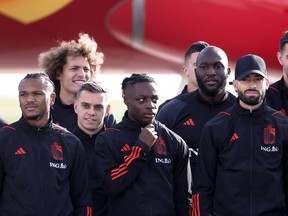 Members of Belgian's national football team (L-R) Kevin De Bruyne, Lois Openda, Wout Faes, Leandro Trossard, Jeremy Doku, Romelu Lukaku and Yannick Carrasco pose for a photo near the new Brussels Airlines Belgian Icon "Trident" plane at the Zaventem airport, on November 15, 2022, before the team departure to Kuwait on their way to the 2022 World Cup in Qatar.