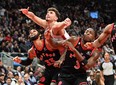 Houston Rockets' Alperen Sengun (centre) battles for position with Raptors' Gary Trent Jr. and O.G. Anunoby in the first half at Scotiabank Arena on Wednesday, Nov. 9, 2022.