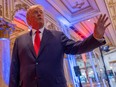 Former U.S. President Donald Trump talks to the press on the grounds of his Mar-a-Lago resort on midterm elections night in Palm Beach, Fla., Tuesday, Nov. 8, 2022.