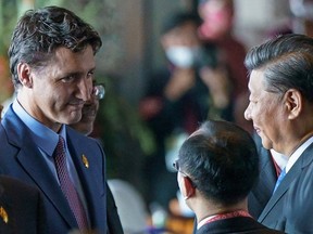 Canada's Prime Minister Justin Trudeau speaks with China's President Xi Jinping at the G20 Leaders' Summit in Bali, Indonesia, on Nov. 15, 2022.