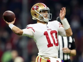 Jimmy Garoppolo of the 49ers throws a pass against the Cardinals during second quarter NFL action at Estadio Azteca in Mexico City, Monday, Nov. 21, 2022.
