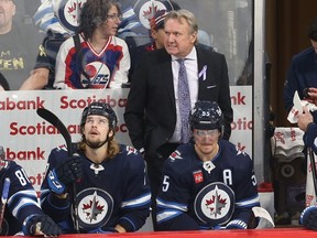 Winnipeg Jets head coach Rick Bowness looks intense behind the bench against the Colorado Avalanche on Nov. 29, 2022.