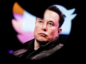Elon Musk's photo is seen through a Twitter logo in this illustration taken Oct. 28, 2022.