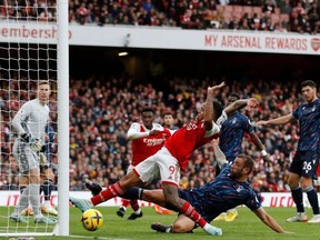 Arsenal's Brazilian striker Gabriel Jesus (C) just fails to reach a cross with the goal at his mercy during the English Premier League football match between Arsenal and Nottingham Forest at the Emirates Stadium in London on October 30, 2022.