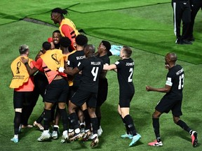Canada players celebrate after Canada's forward #19 Alphonso Davies scored their team's first goal during the Qatar 2022 World Cup Group F football match between Croatia and Canada at the Khalifa International Stadium in Doha on November 27, 2022.