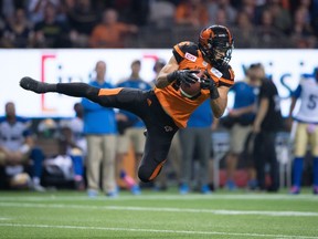B.C. Lions' Bryan Burnham makes a reception against the Winnipeg Blue Bombers during their 2016 playoff game at B.C. Place.