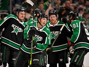 Dallas Stars left wing Jason Robertson (21) and center Roope Hintz (24) and center Joe Pavelski (16) and center Tyler Seguin (91) celebrates Robertson scoring the game tying goal against the Winnipeg Jets during the third period at the American Airlines Center in Dallas on Friday, Nov. 25, 2022. Dallas scored two late goals, both with their net vacated to force overtime in a 5-4 Winnipeg victory.