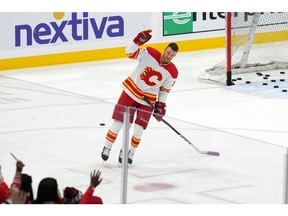 Nov 19, 2022; Sunrise, Florida, USA; Calgary Flames center Jonathan Huberdeau (10) acknowledges the fans after his pre skate warmup prior to the game against the Florida Panthers at FLA Live Arena. Mandatory Credit: Jasen Vinlove-USA TODAY Sports