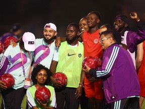 Canada hold a welcome event with local volunteers at the Umm Salal Sport Club, in Doha, Qatar on November 14, 2022 Canada's Ismael Kone poses for a photograph with local volunteers.