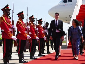 Prime Minister Justin Trudeau is greeted by Cambodia's Minister of Women's Affairs Ing Kantha Phavi as he arrives in Phnom Penh, Cambodia on Saturday, Nov. 12, 2022, to attend the ASEAN Summit.