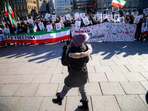 Demonstrators on Parliament Hill Saturday protesting the execution of a protester in Iran earlier this week.