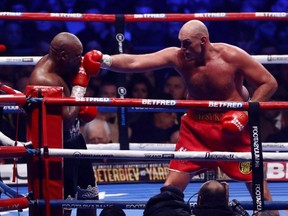 Tyson Fury (right) in action during his fight against Derek Chisora for the WBC World Heavyweight Title at Tottenham Hotspur Stadium in London, Saturday, Dec. 3, 2022.