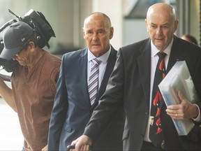 Chris Dawson (centre) arrives at Downing Centre Local Court on Feb. 10, 2020 in Sydney, Australia.