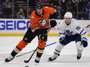 Anaheim Ducks center Ryan Getzlaf moves the puck ahead of Toronto Maple Leafs center Alexander Kerfoot during the first period at Honda Center.