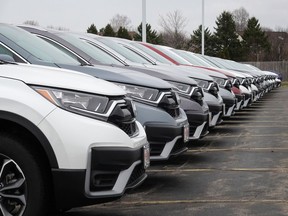 Cars sit on the lot at a Honda dealership in this file photo.