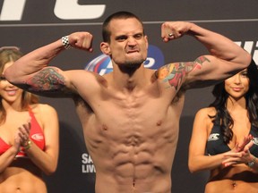 James Krause flexes during the weigh-in for UFC 161 at MTS Centre on Fri., June 14 in Winnipeg.